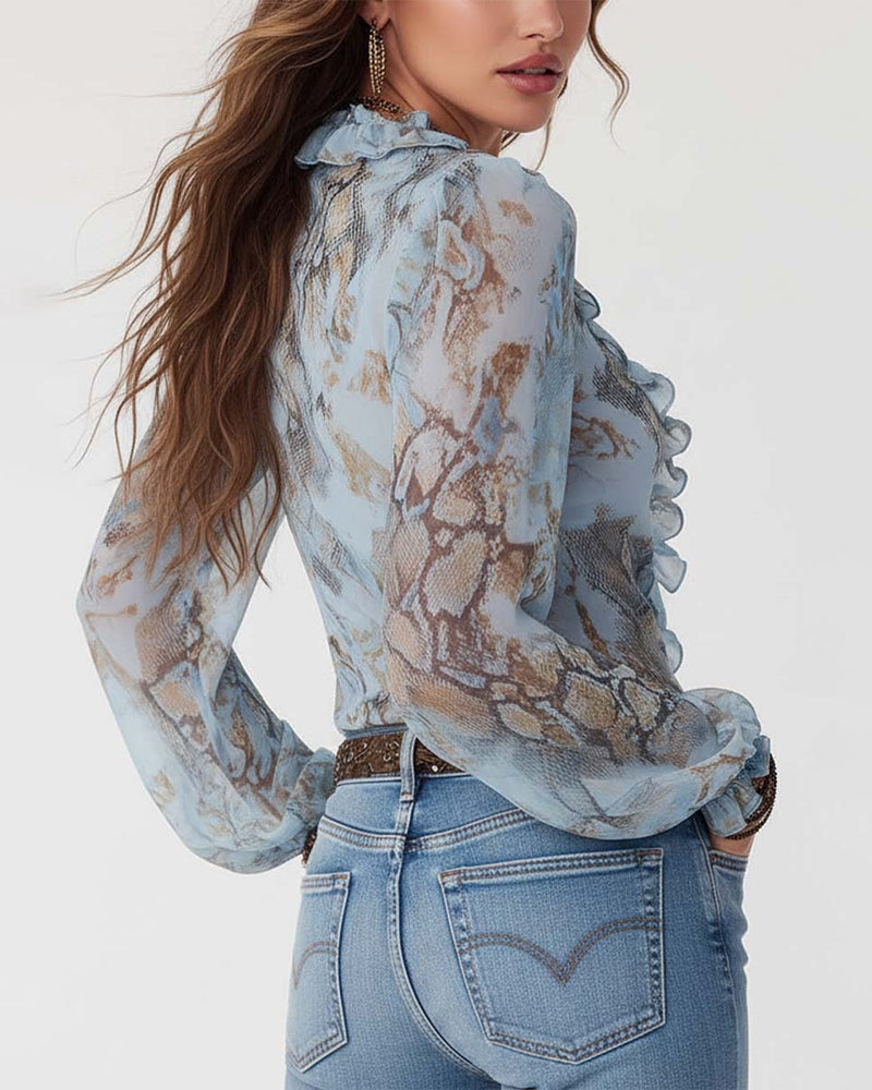 BLUSA ESTAMPADA CON MANGA LARGA CON CIERRE CON CREMALLERA Y VOLANTES