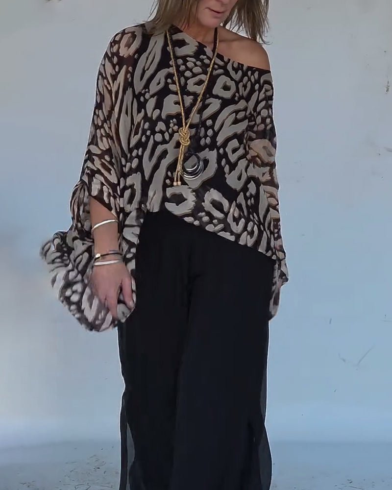 BLUSA CON MANGA LARGA CON ESTAMPADO MURCIÉLAGO ASIMÉTRICO