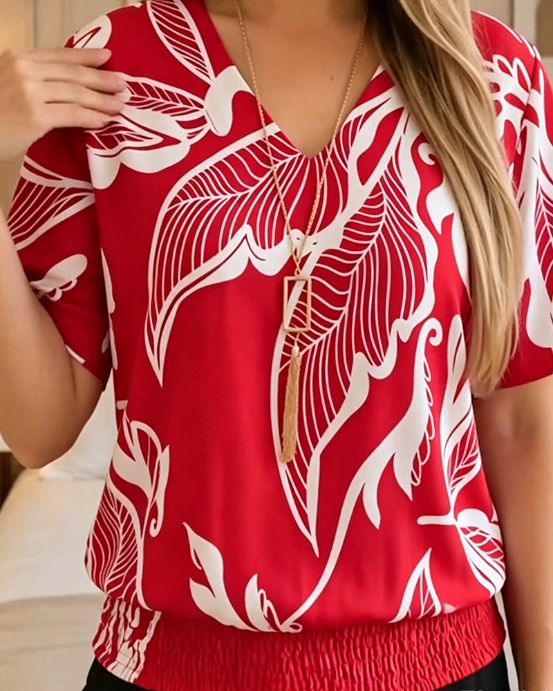 BLUSA ESTAMPADO FLORAL BAJO ELÁSTICO MANGA CORTA