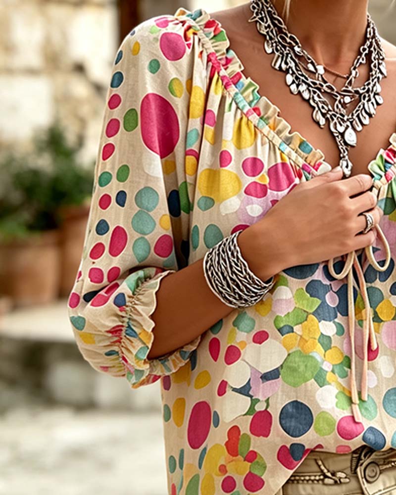 BLUSA CUELLO DE V DE LUNARES CON CORDONES