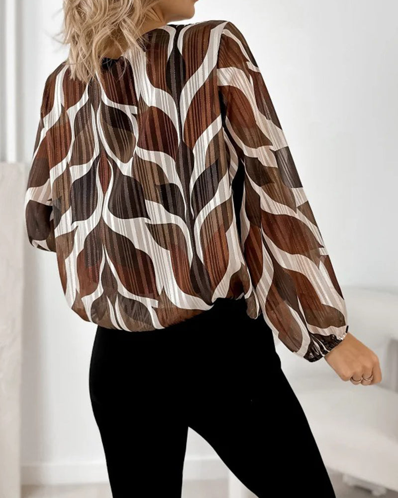 BLUSA CON MANGAS GLOBO Y CUELLO REDONDO