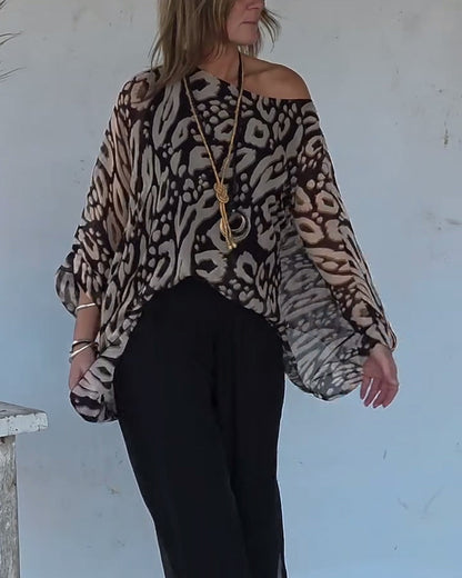 BLUSA CON MANGA LARGA CON ESTAMPADO MURCIÉLAGO ASIMÉTRICO