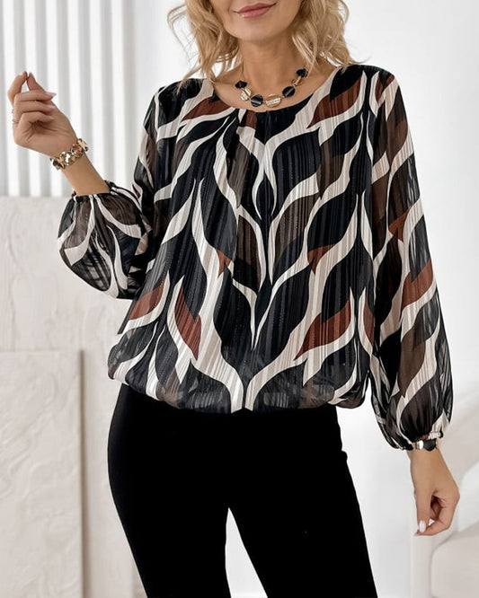 BLUSA CON MANGAS GLOBO Y CUELLO REDONDO