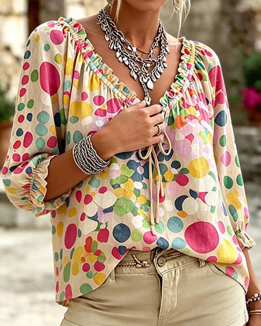 BLUSA CUELLO DE V DE LUNARES CON CORDONES