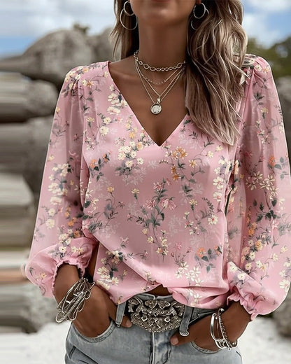 BLUSA FLORAL CUELLO DE V MANGAS ABULLONADAS