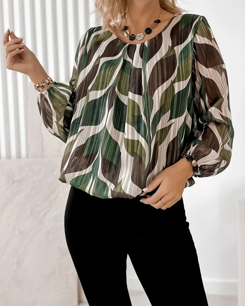 BLUSA CON MANGAS GLOBO Y CUELLO REDONDO