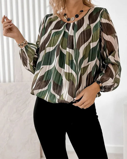 BLUSA CON MANGAS GLOBO Y CUELLO REDONDO