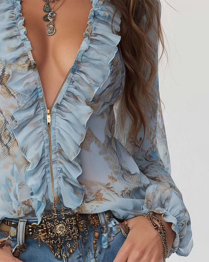 BLUSA ESTAMPADA CON MANGA LARGA CON CIERRE CON CREMALLERA Y VOLANTES
