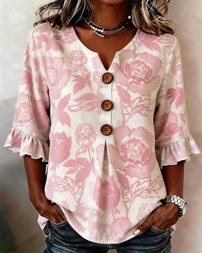BLUSA ESTAMPADA PUÑO CON VOLANTES