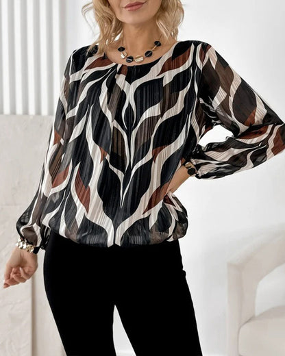 BLUSA CON MANGAS GLOBO Y CUELLO REDONDO