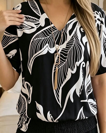 BLUSA ESTAMPADO FLORAL BAJO ELÁSTICO MANGA CORTA