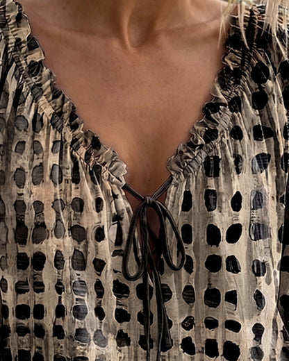 BLUSA DE LUNARES CON CORDONES