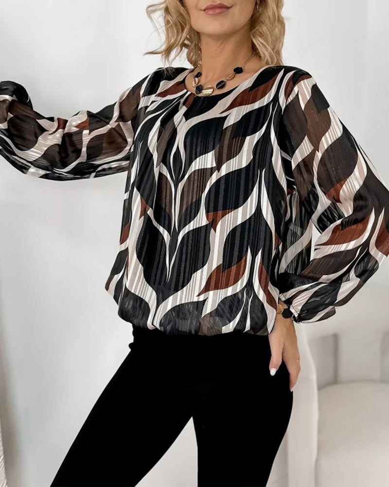 BLUSA CON MANGAS GLOBO Y CUELLO REDONDO