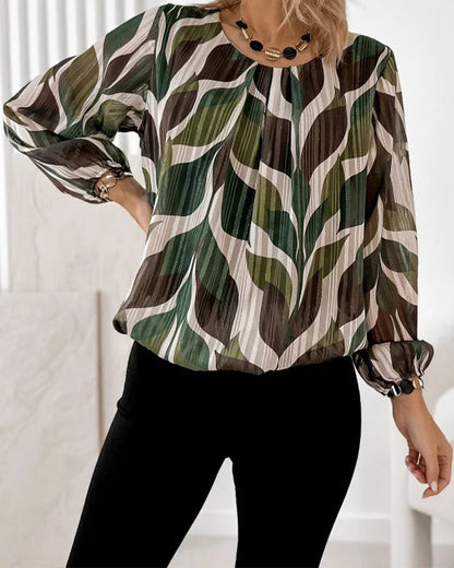 BLUSA CON MANGAS GLOBO Y CUELLO REDONDO