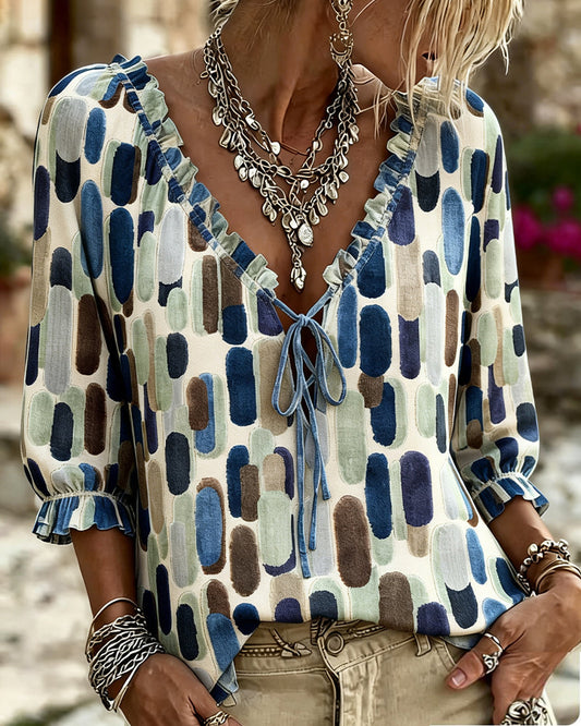 BLUSA BLOQUES DE COLOR VOLANTE ATADO CUELLO DE V