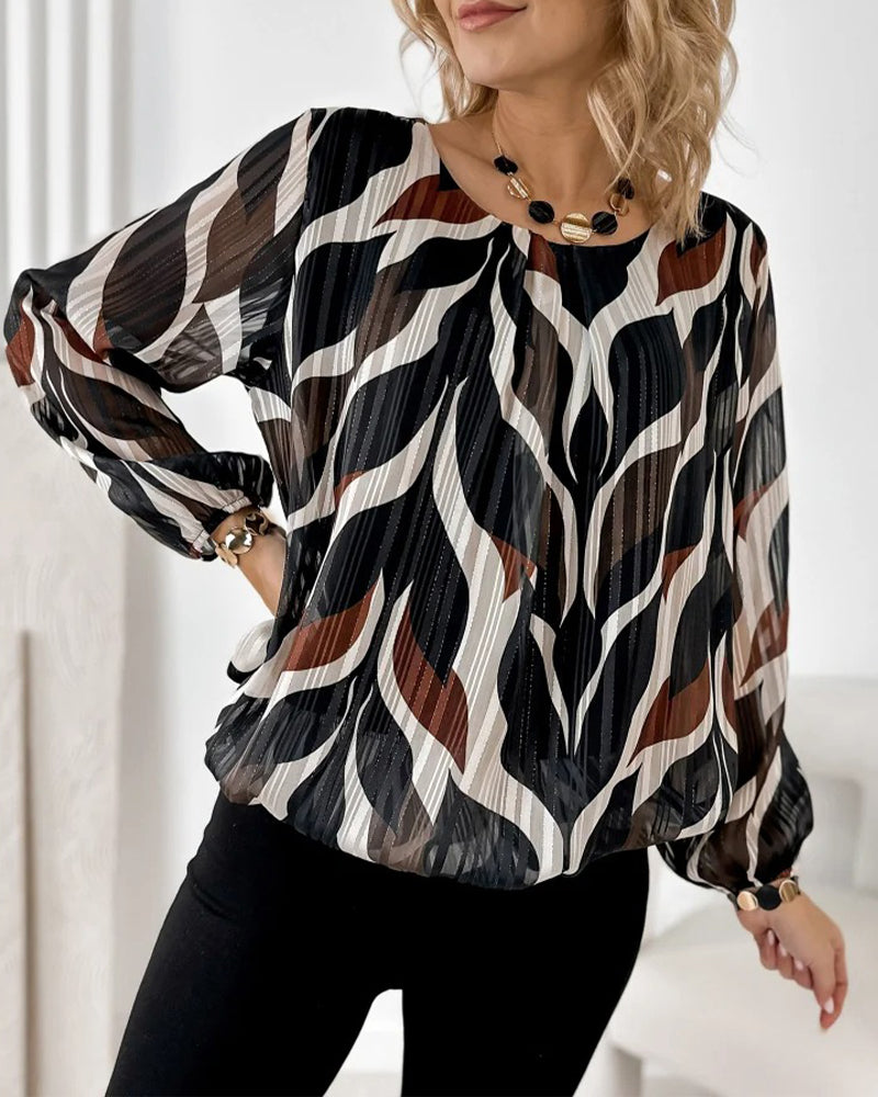 BLUSA CON MANGAS GLOBO Y CUELLO REDONDO