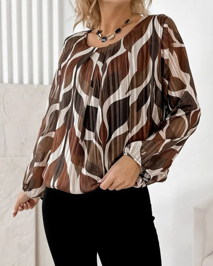 BLUSA CON MANGAS GLOBO Y CUELLO REDONDO