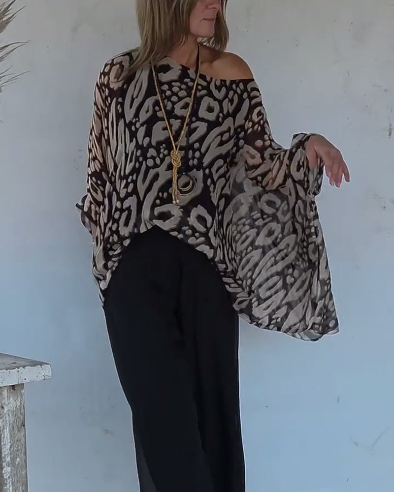 BLUSA CON MANGA LARGA CON ESTAMPADO MURCIÉLAGO ASIMÉTRICO