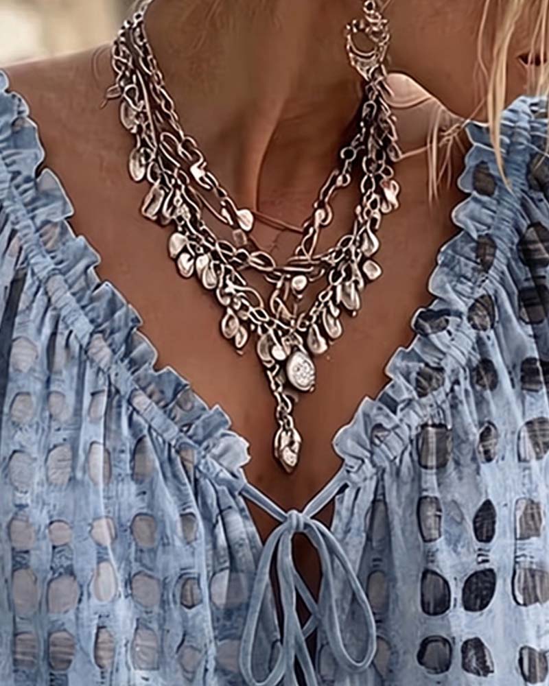 BLUSA DE LUNARES CON CORDONES