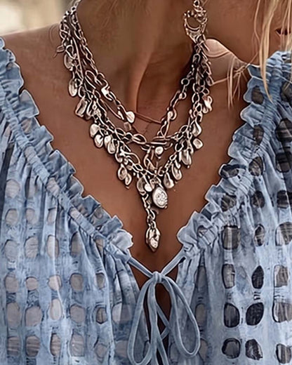 BLUSA DE LUNARES CON CORDONES