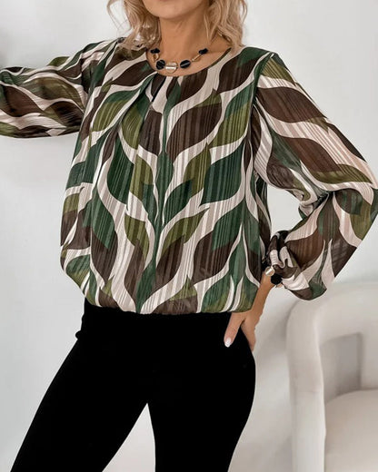 BLUSA CON MANGAS GLOBO Y CUELLO REDONDO