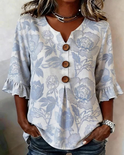BLUSA ESTAMPADA PUÑO CON VOLANTES