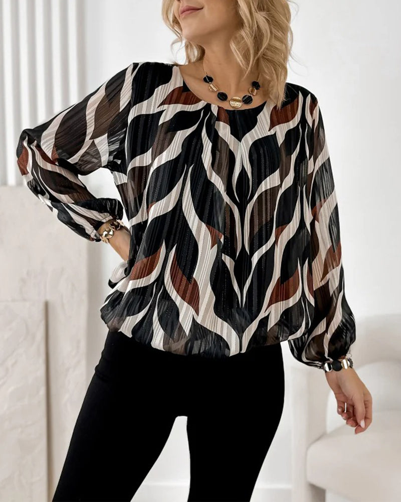 BLUSA CON MANGAS GLOBO Y CUELLO REDONDO
