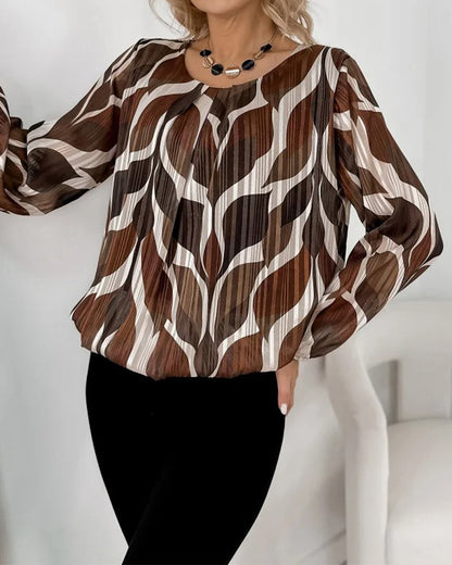 BLUSA CON MANGAS GLOBO Y CUELLO REDONDO