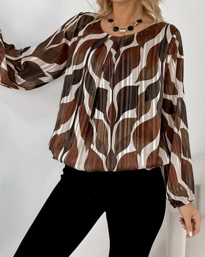 BLUSA CON MANGAS GLOBO Y CUELLO REDONDO