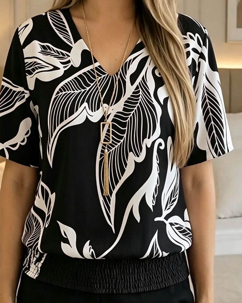 BLUSA ESTAMPADO FLORAL BAJO ELÁSTICO MANGA CORTA