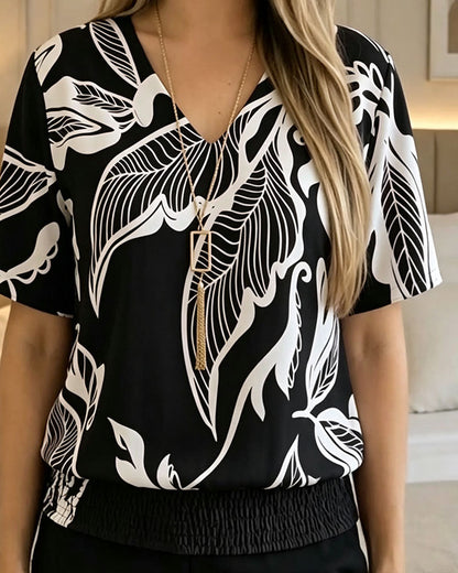 BLUSA ESTAMPADO FLORAL BAJO ELÁSTICO MANGA CORTA