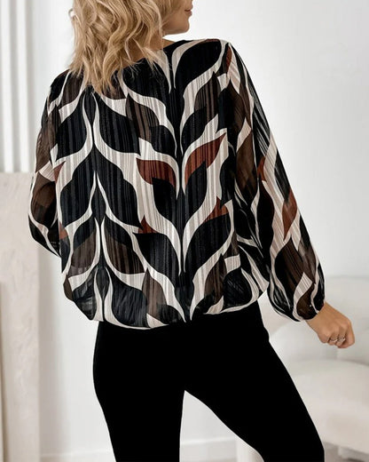 BLUSA CON MANGAS GLOBO Y CUELLO REDONDO