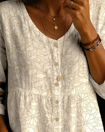 BLUSA ESTAMPADA CON CUELLO DE V CON BOTONES SOBRE EL DELANTERO