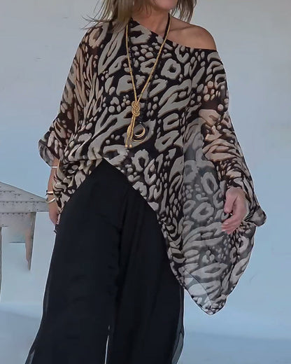 BLUSA CON MANGA LARGA CON ESTAMPADO MURCIÉLAGO ASIMÉTRICO