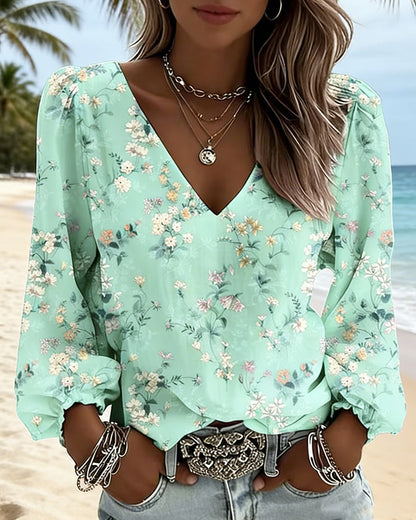 BLUSA FLORAL CUELLO DE V MANGAS ABULLONADAS