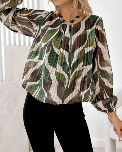 BLUSA CON MANGAS GLOBO Y CUELLO REDONDO