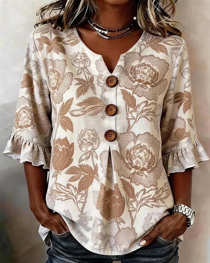 BLUSA ESTAMPADA PUÑO CON VOLANTES
