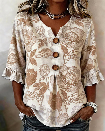 BLUSA ESTAMPADA PUÑO CON VOLANTES