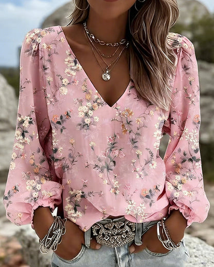 BLUSA FLORAL CUELLO DE V MANGAS ABULLONADAS