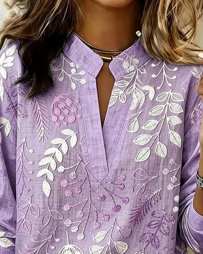 BLUSA CON ESTAMPADO FLORAL Y CUELLO ALTO