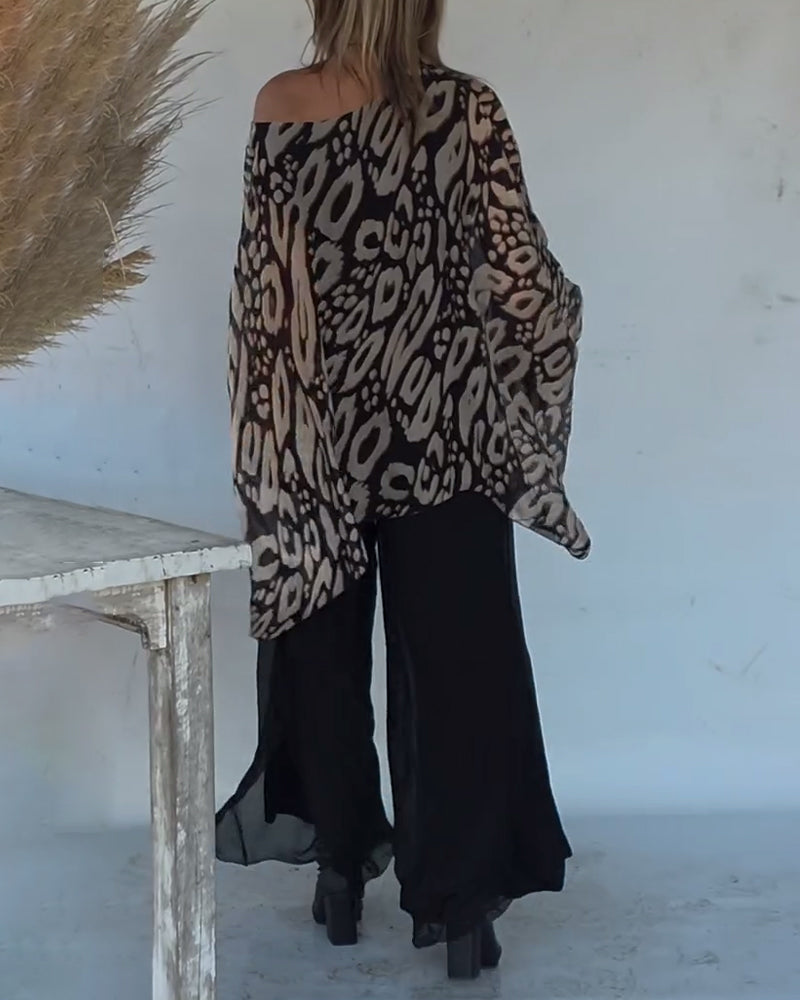 BLUSA CON MANGA LARGA CON ESTAMPADO MURCIÉLAGO ASIMÉTRICO