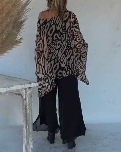 BLUSA CON MANGA LARGA CON ESTAMPADO MURCIÉLAGO ASIMÉTRICO