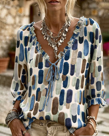 BLUSA BLOQUES DE COLOR VOLANTE ATADO CUELLO DE V