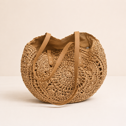 LOLA | BOLSO REDONDO DE PAJA TRENZADA CON DISEÑO — COÑAC