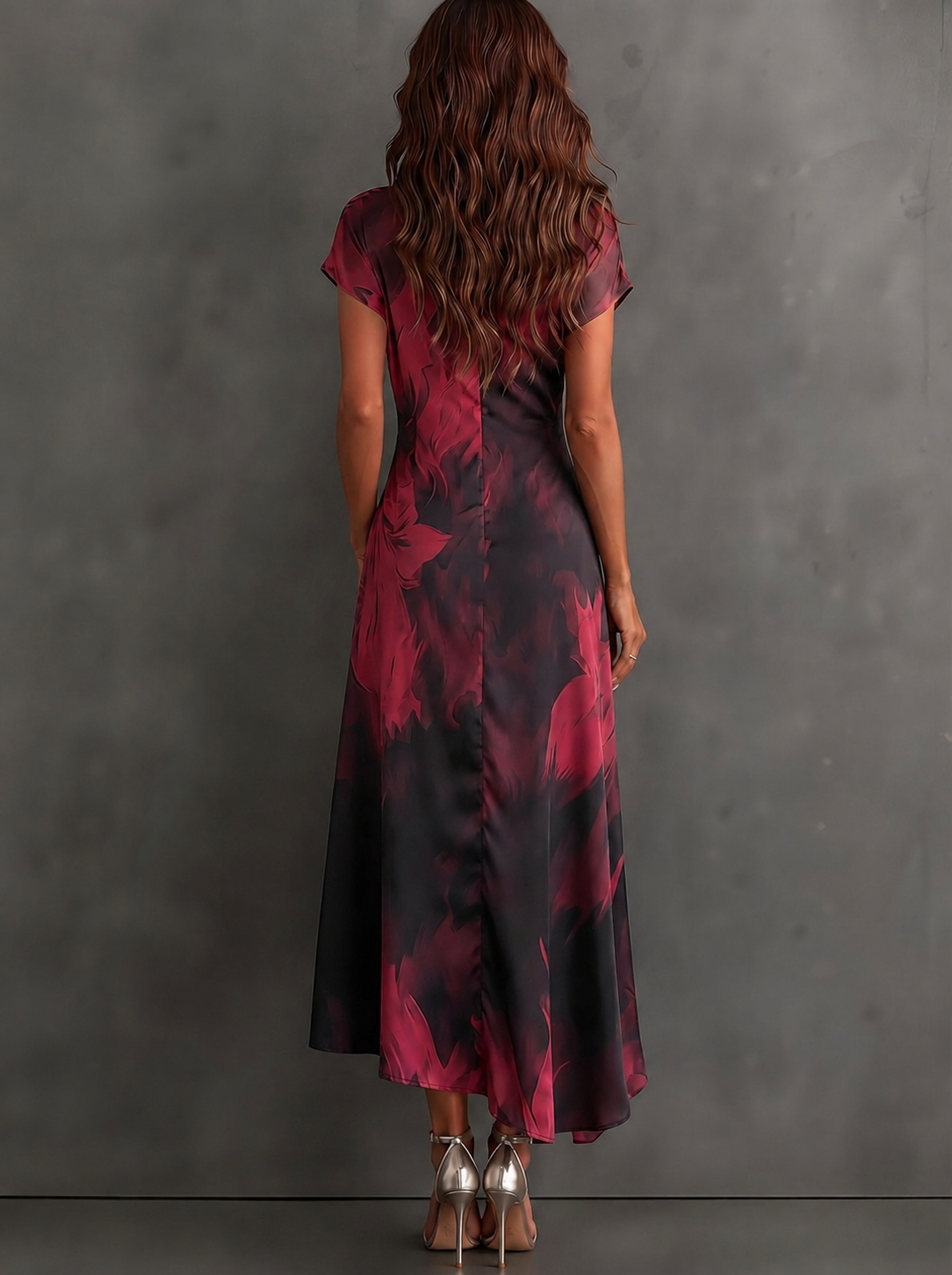 VESTIDO MIDI CRUZADO CON ESTAMPADO ABSTRACTO ROJO Y NEGRO, CUELLO CAMISERO CON ESCOTE EN V, MANGA CORTA, CINTURA ANUDADA Y BAJO ASIMÉTRICO CON VOLANTE