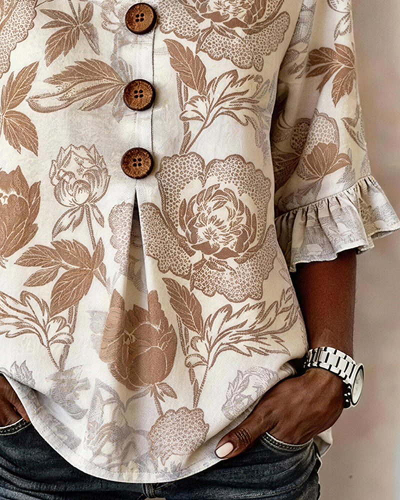 BLUSA ESTAMPADA PUÑO CON VOLANTES