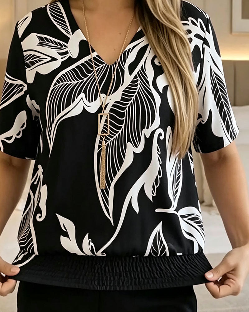 BLUSA ESTAMPADO FLORAL BAJO ELÁSTICO MANGA CORTA
