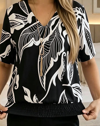 BLUSA ESTAMPADO FLORAL BAJO ELÁSTICO MANGA CORTA