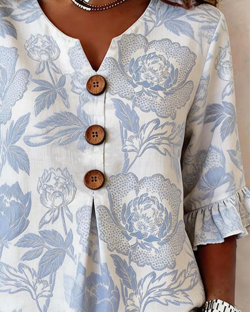 BLUSA ESTAMPADA PUÑO CON VOLANTES