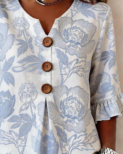 BLUSA ESTAMPADA PUÑO CON VOLANTES